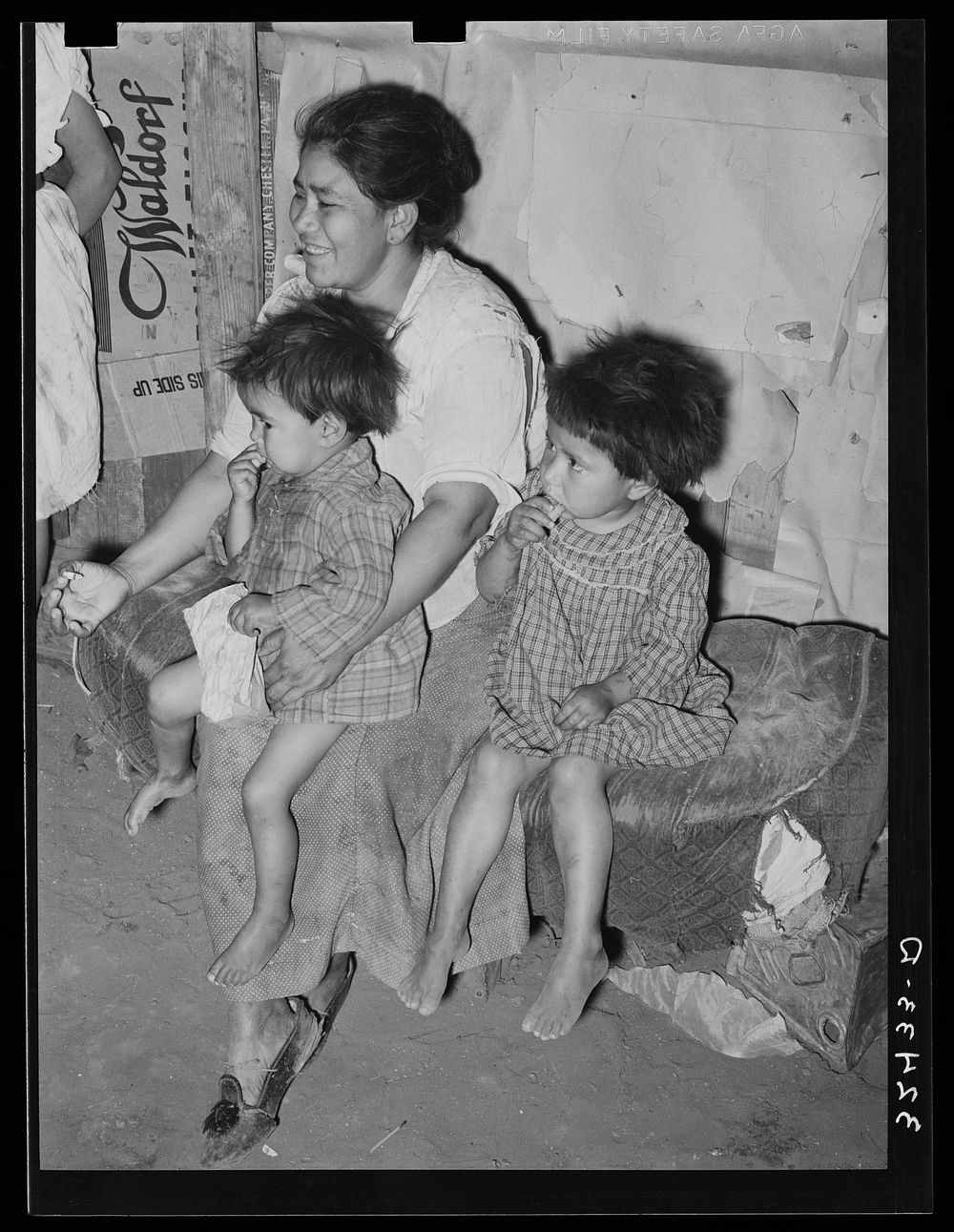 Mexican mother with her children in their home in the outskirts of San Antonio, Texas by Russell Lee