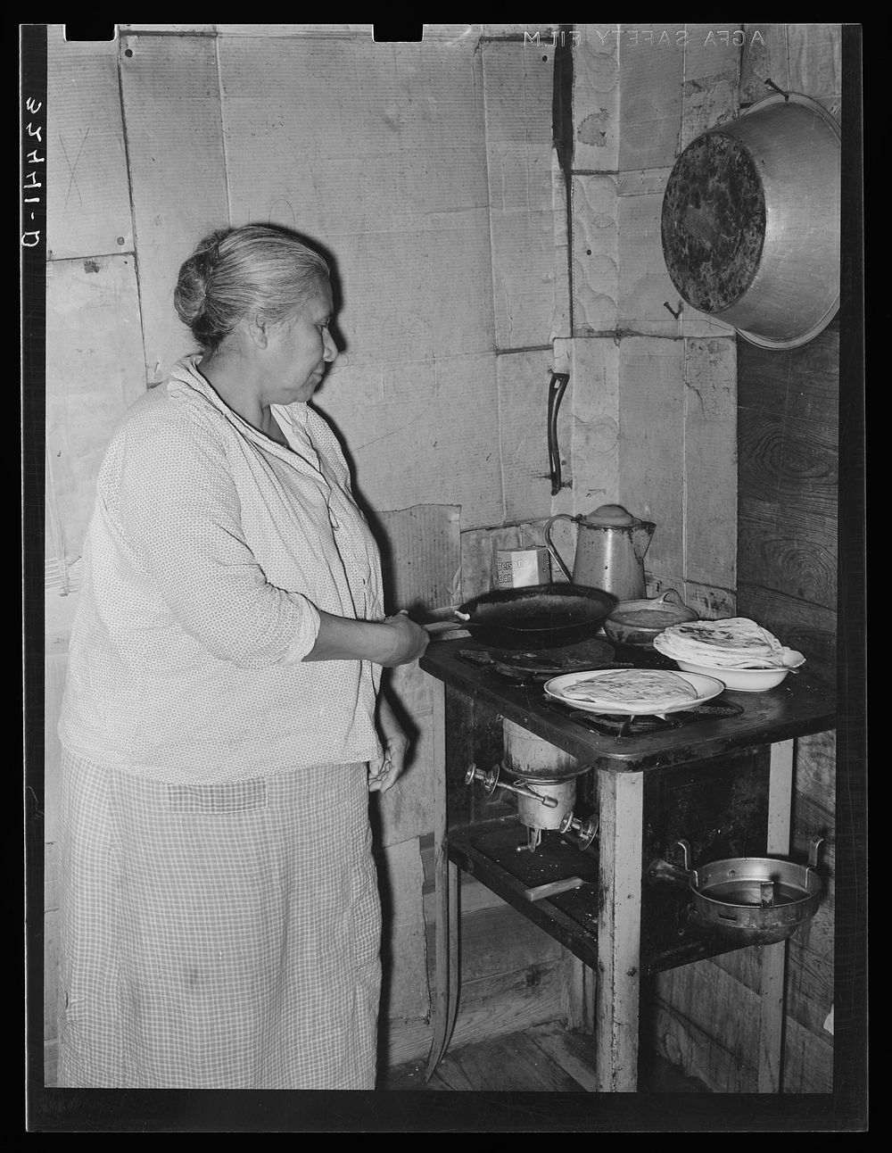Mexican woman cooking tortillas. San Antonio, Texas by Russell Lee