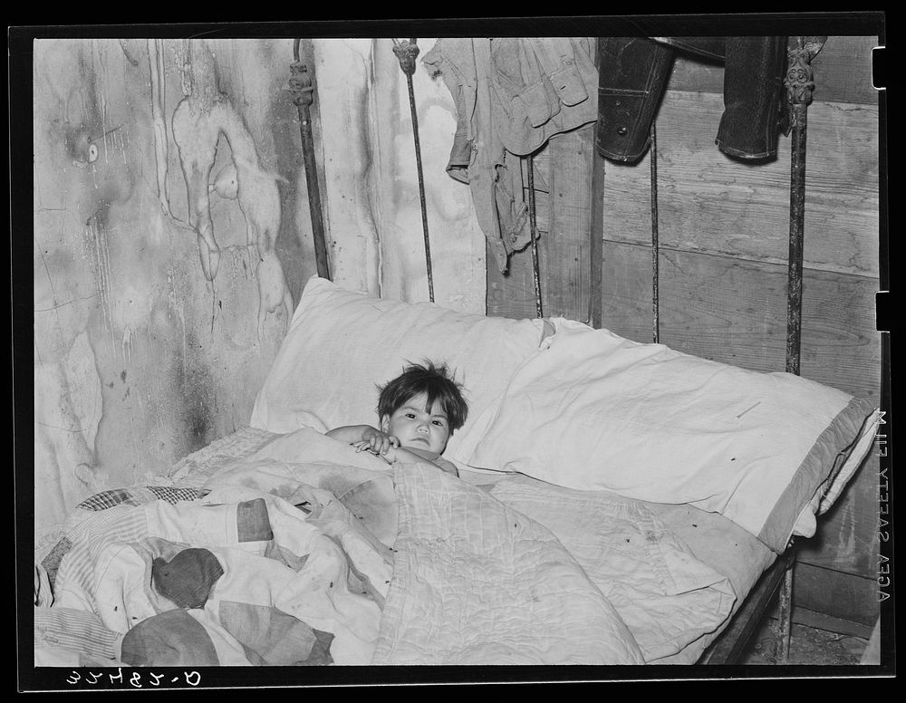 Mexican boy sick in bed. San Antonio, Texas by Russell Lee