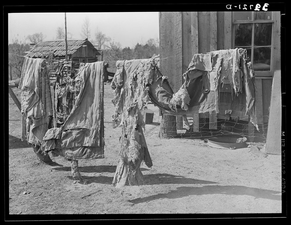 Quilts of family on relief near Jefferson, Texas by Russell Lee