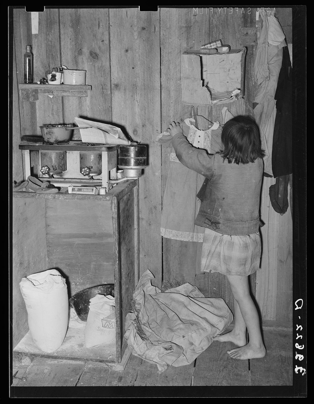 Corner of combined kitchen- bedroom in house provided for migratory berry pickers near Ponchatoula, Louisiana by Russell Lee
