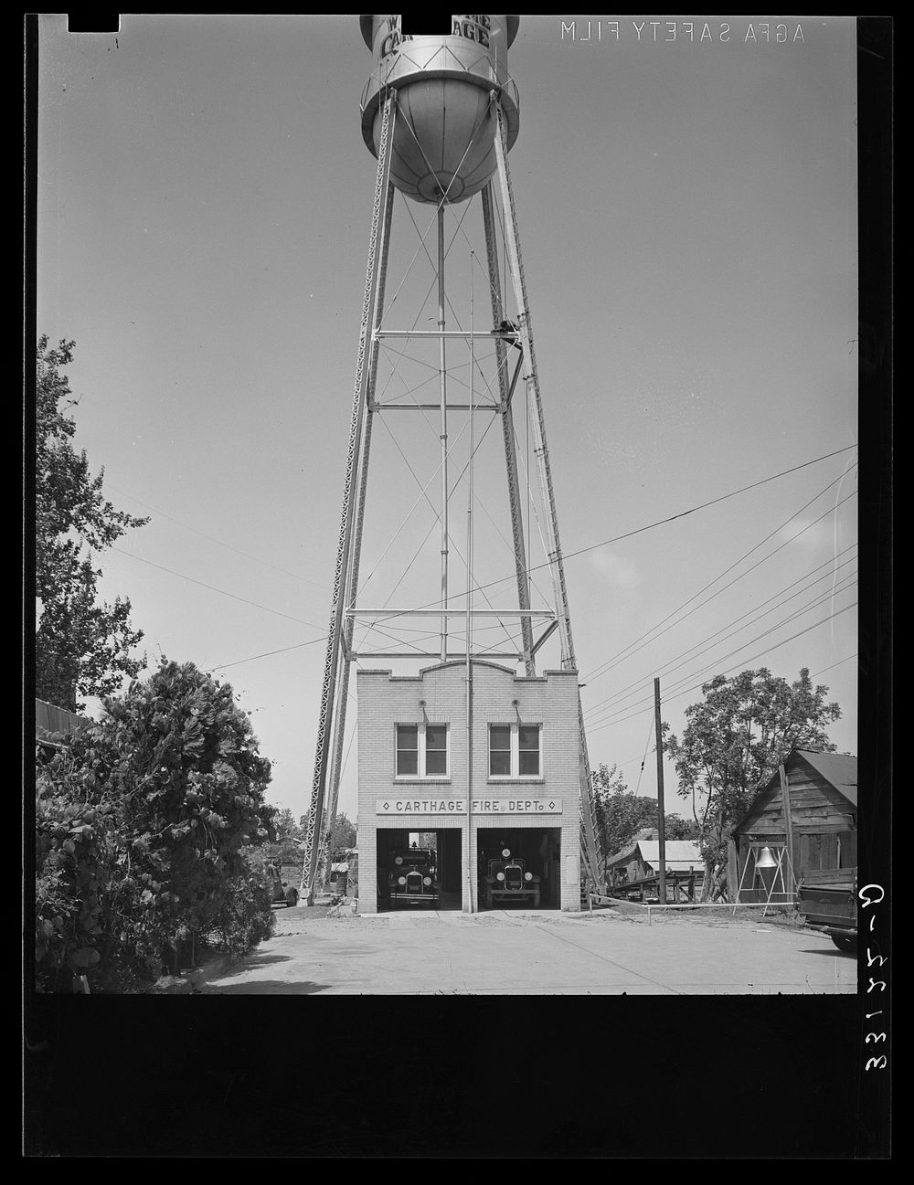 [Untitled photo, possibly related to: Fire station and water tank. Carthage, Texas] by Russell Lee
