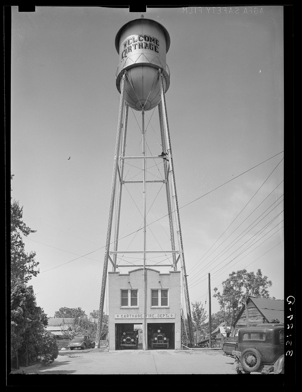 Fire station and water tank. Carthage, Texas by Russell Lee