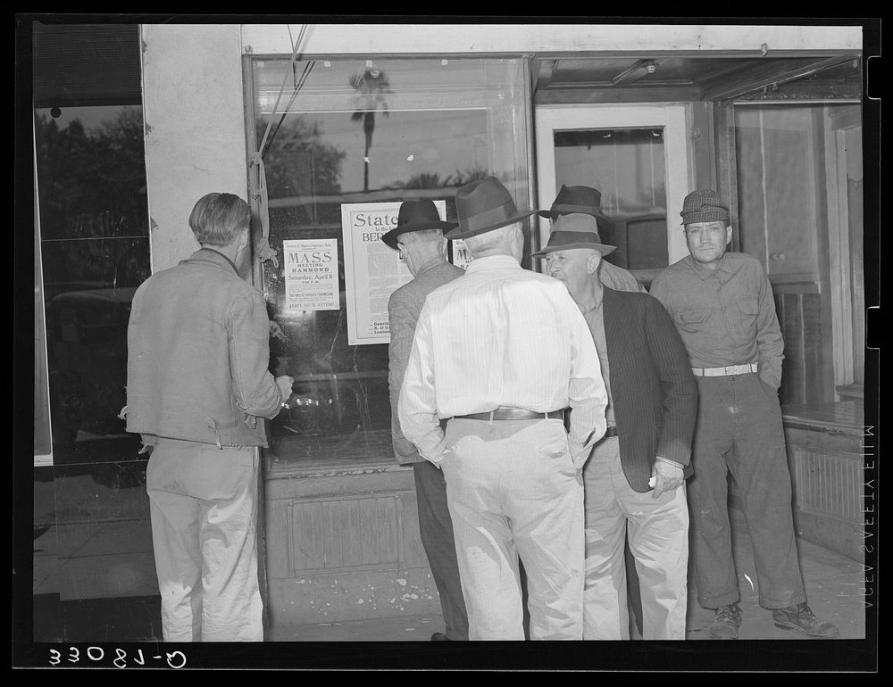Strawberry farmers in front of store. Hammond, Louisiana by Russell Lee