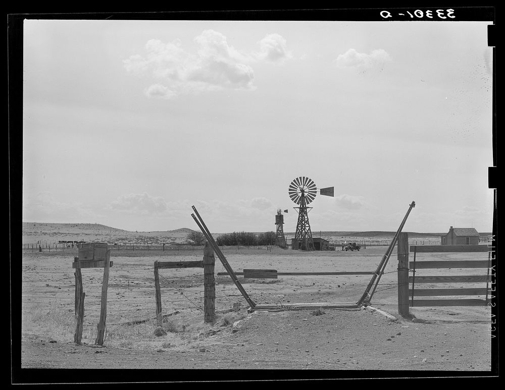 Cattle guard and windmill near Marfa, Texas by Russell Lee