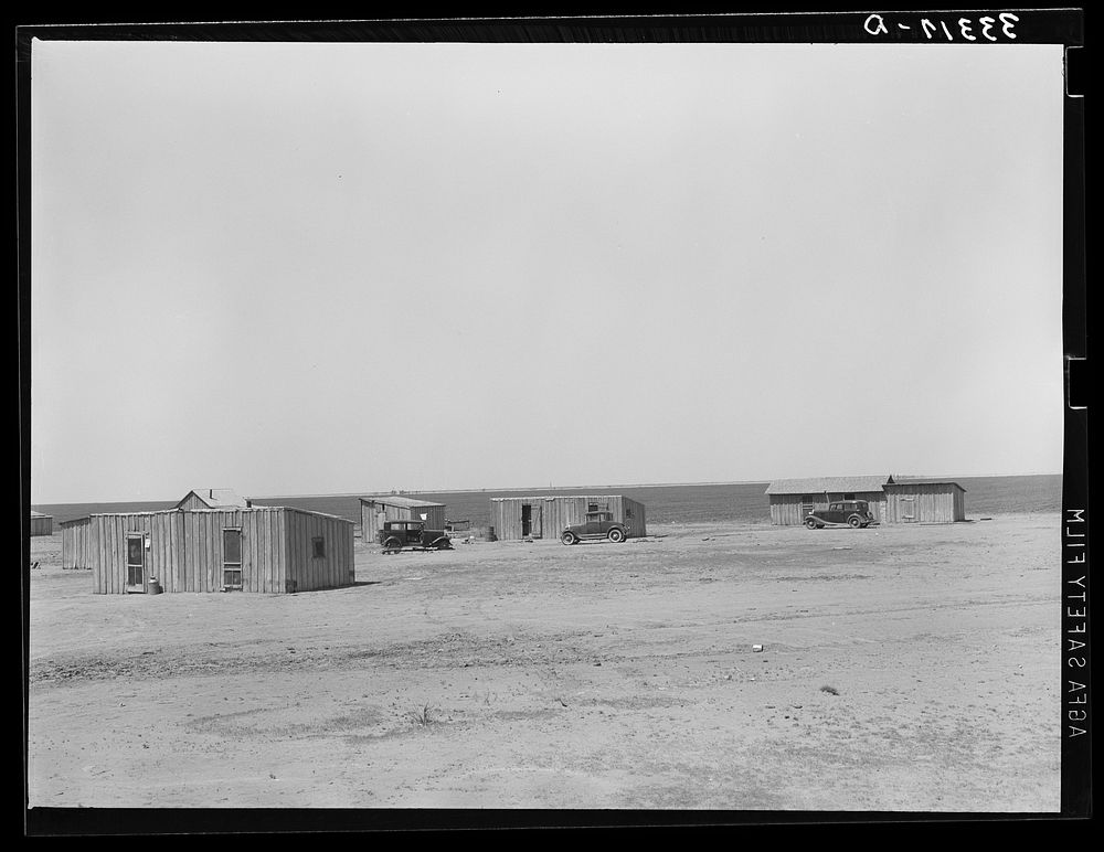 Homes of day laborers on large farm near Ralls, Texas. There are 4900 acres in this farm. Nine tractors are used by Russell…