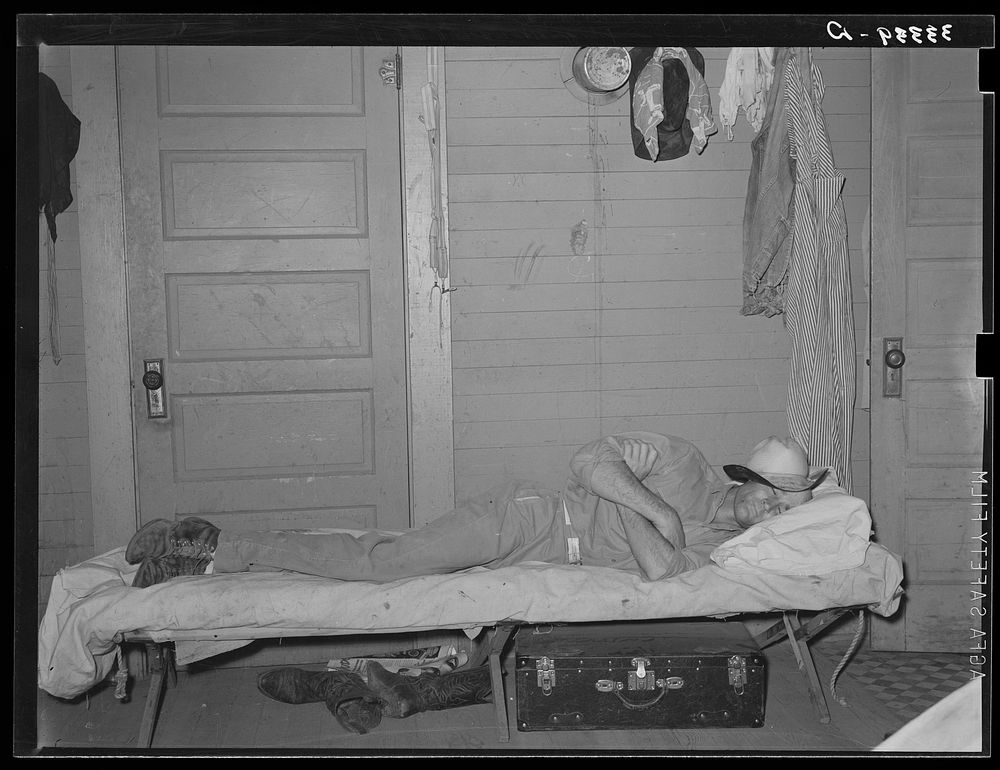 Cook of SMS Ranch asleep after dinner. Ranch near Spur, Texas by Russell Lee