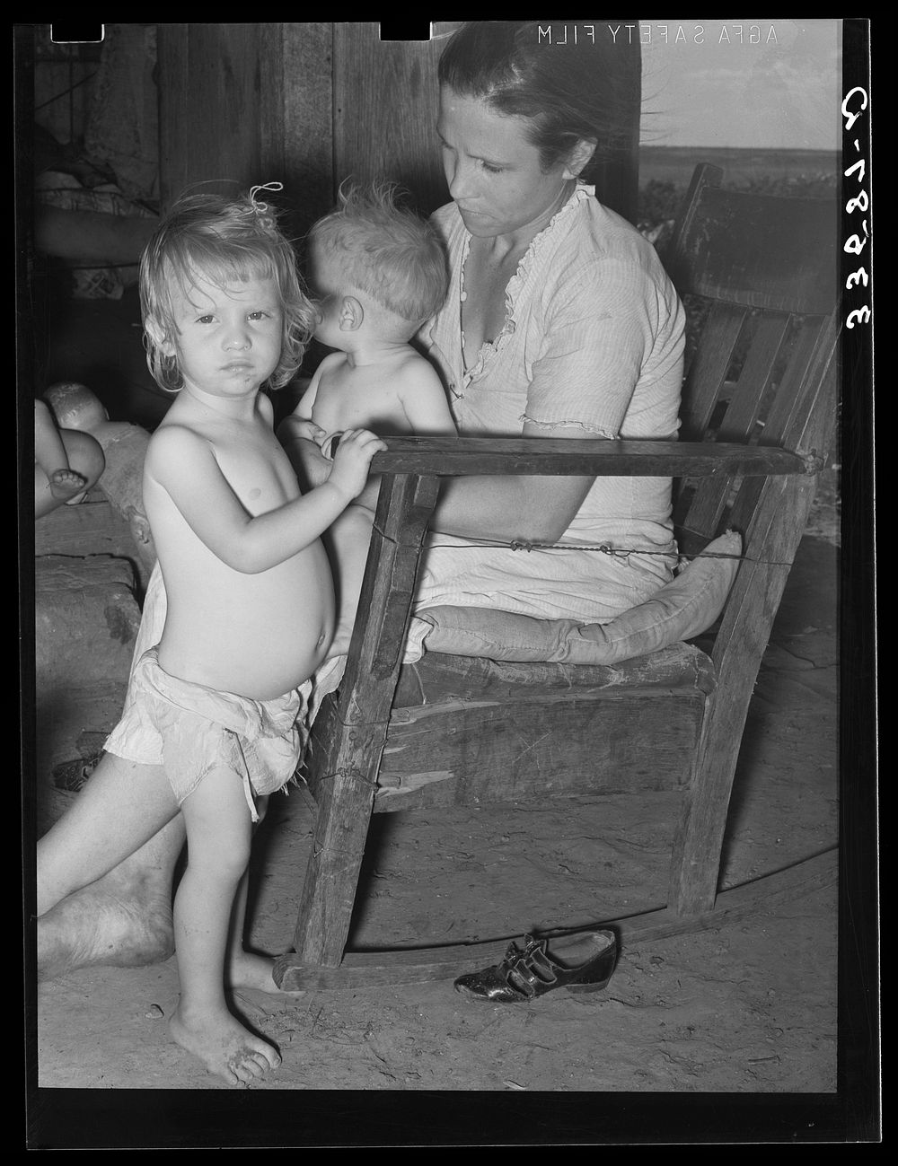 Wife of agricultural day laborer and her children near Tullahassee, Oklahoma. Wagoner County by Russell Lee