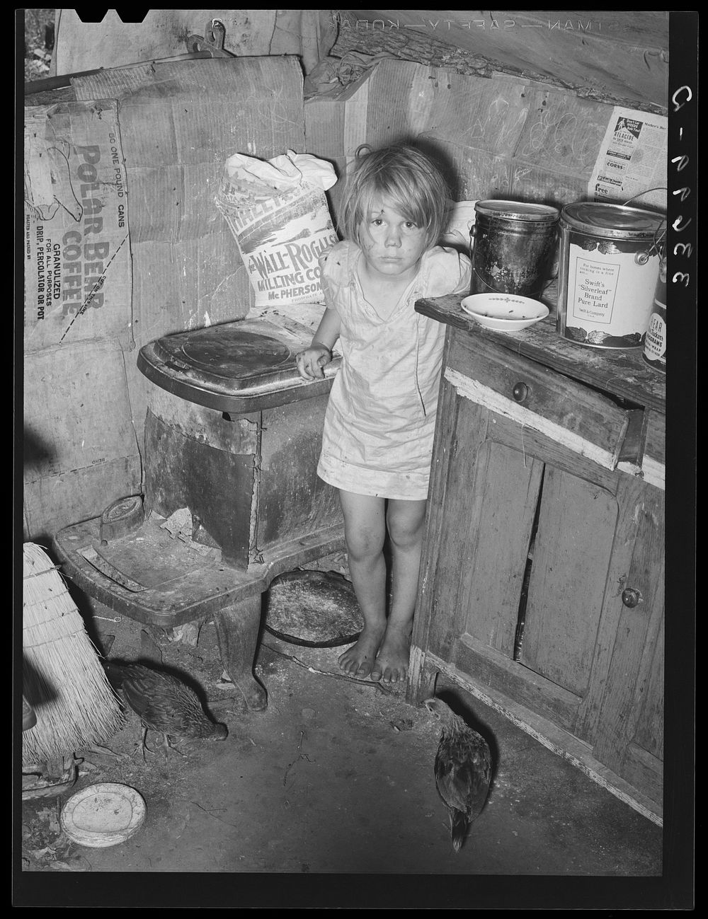 Corner of kitchen in tent home of family near Sallisaw, Oklahoma. Sequoyah County by Russell Lee