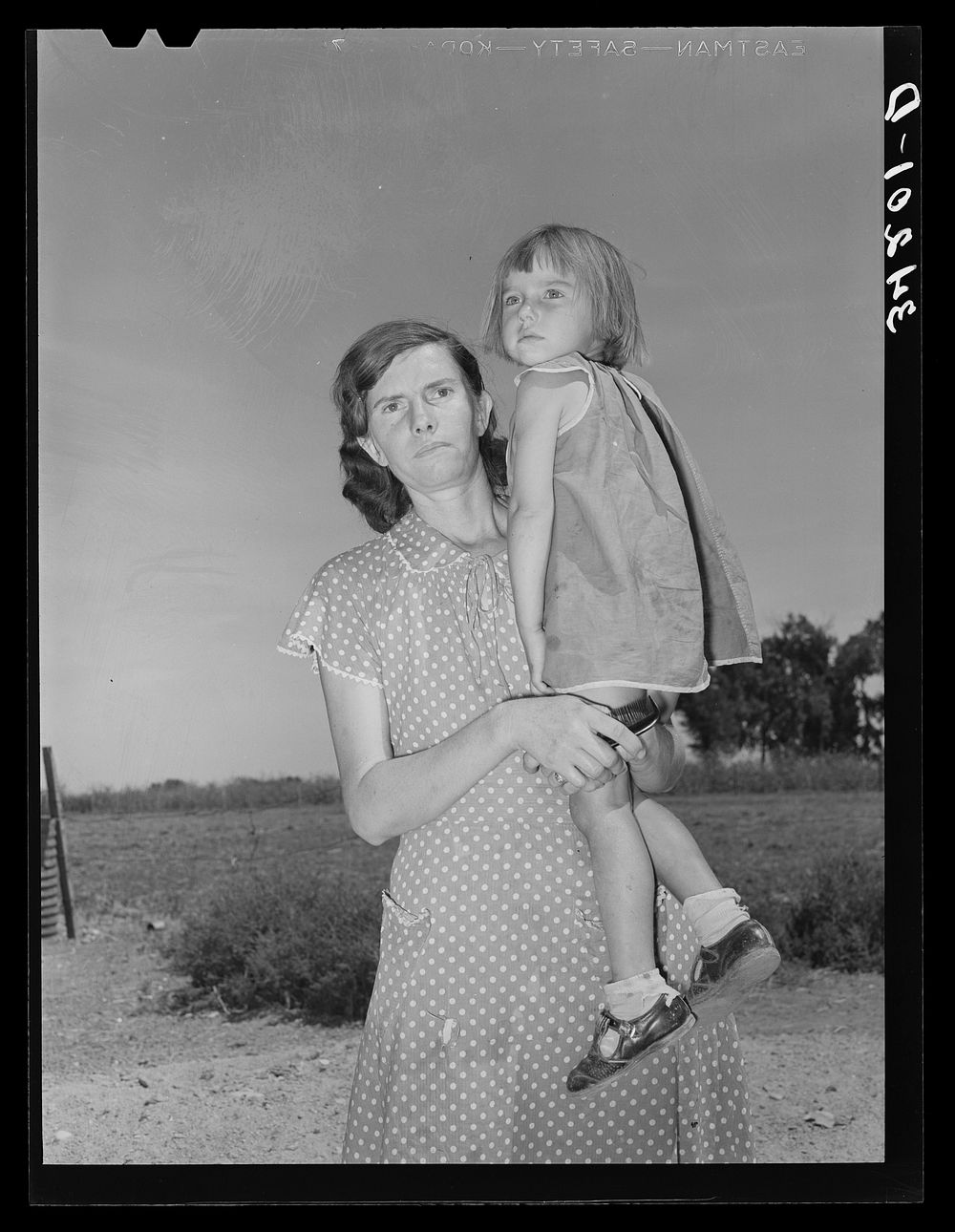 Mrs. Ernest W. Kirk Jr., wife of successful client, with her daughter on farm near Ordway, Colorado by Russell Lee