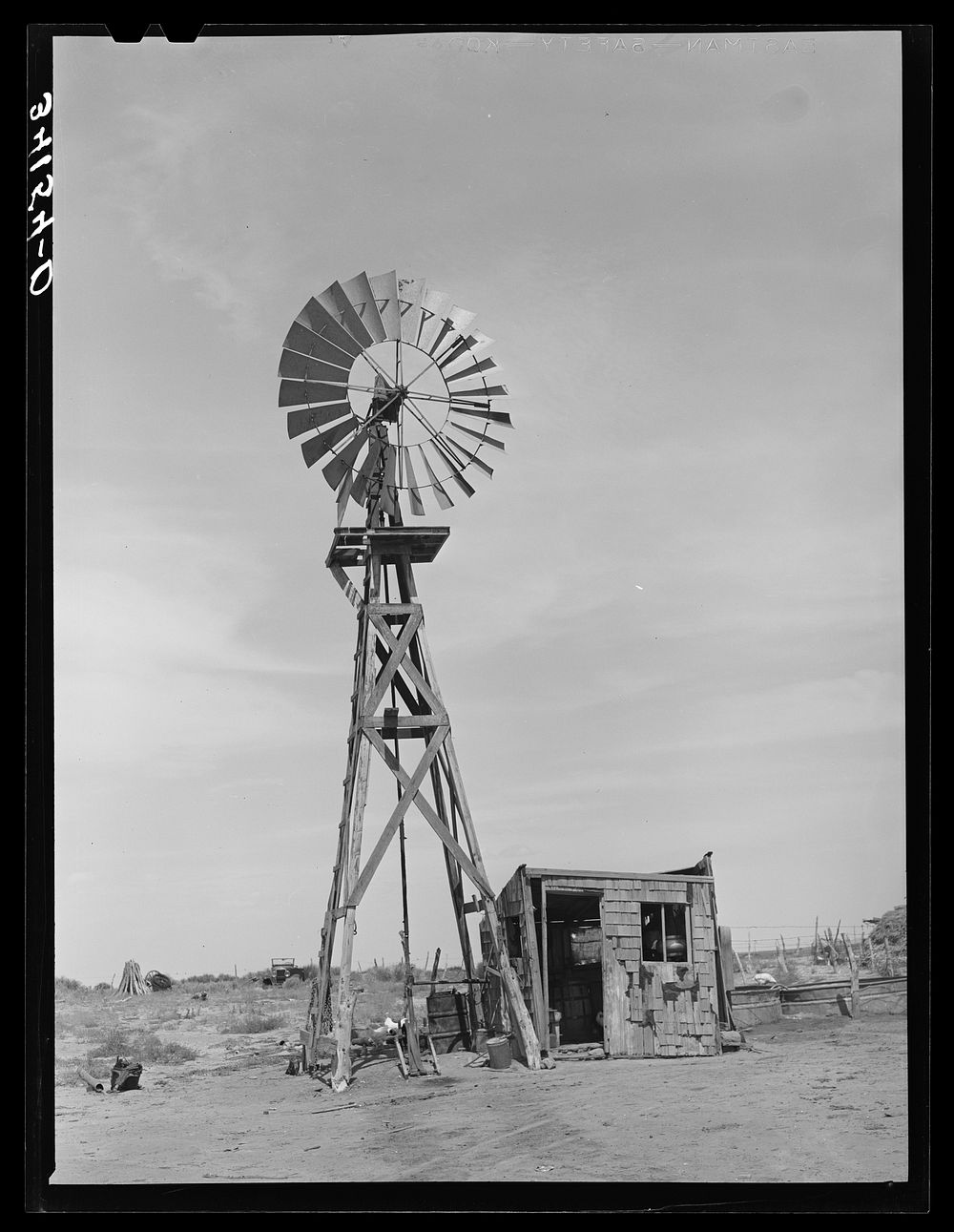 Windmill and milk-house of the Bosley reorganization unit. Baca County, Colorado by Russell Lee