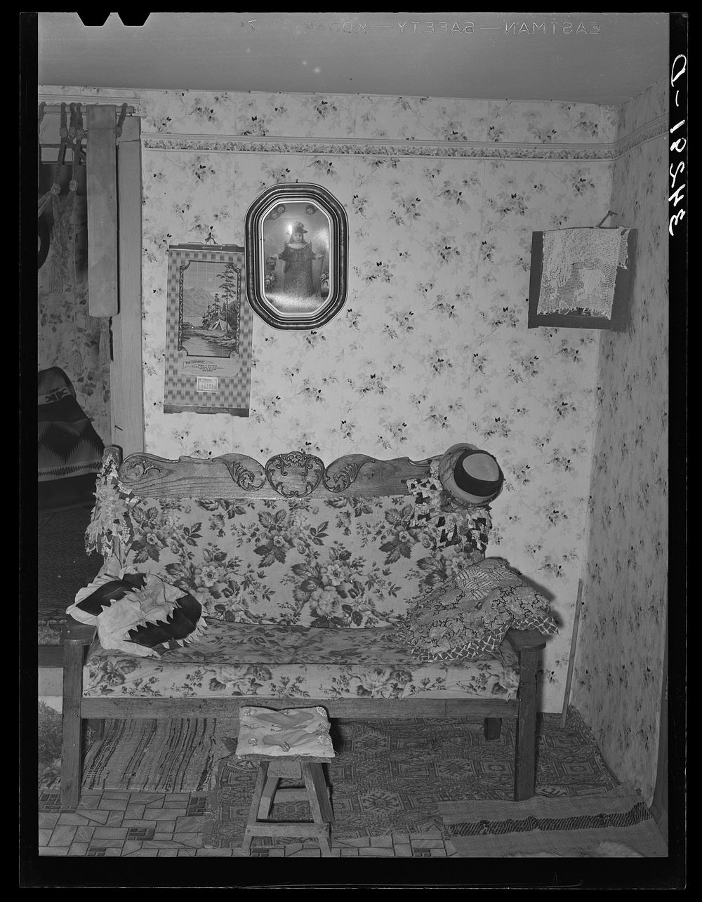 Corner of living room of Spanish-American family near Taos, New Mexico by Russell Lee