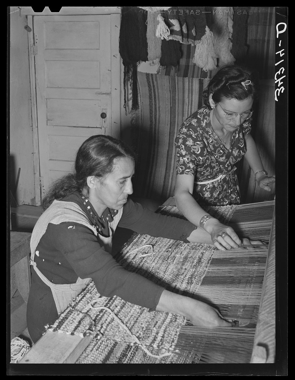 Spanish-American woman weaving rag rug at WPA (Works Progress Administration/Work Projects Administration) project.…