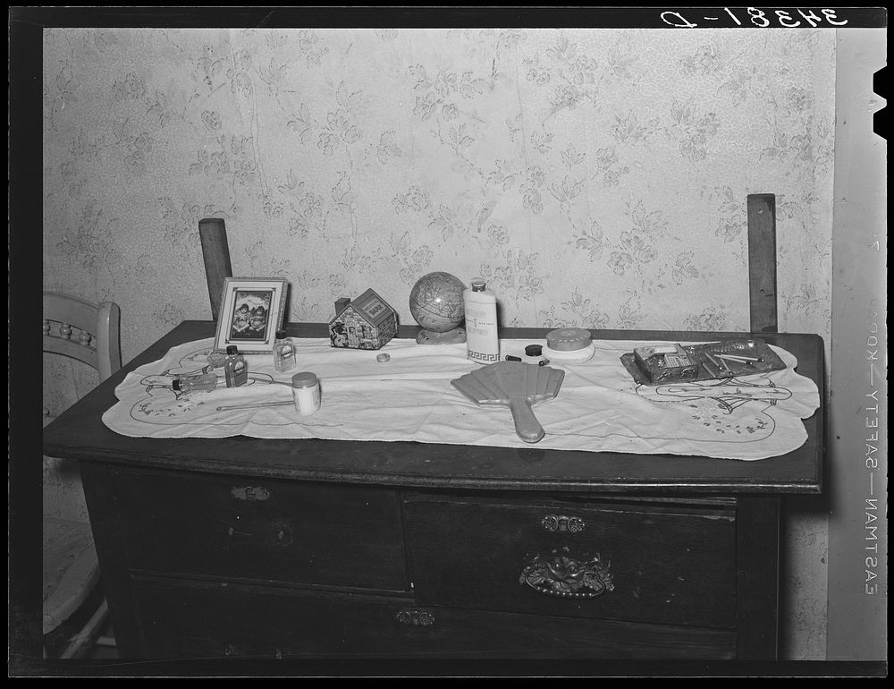 Top of dresser in home of FSA (Farm Security Administration) client. Orange County, near Bradford, Vermont by Russell Lee