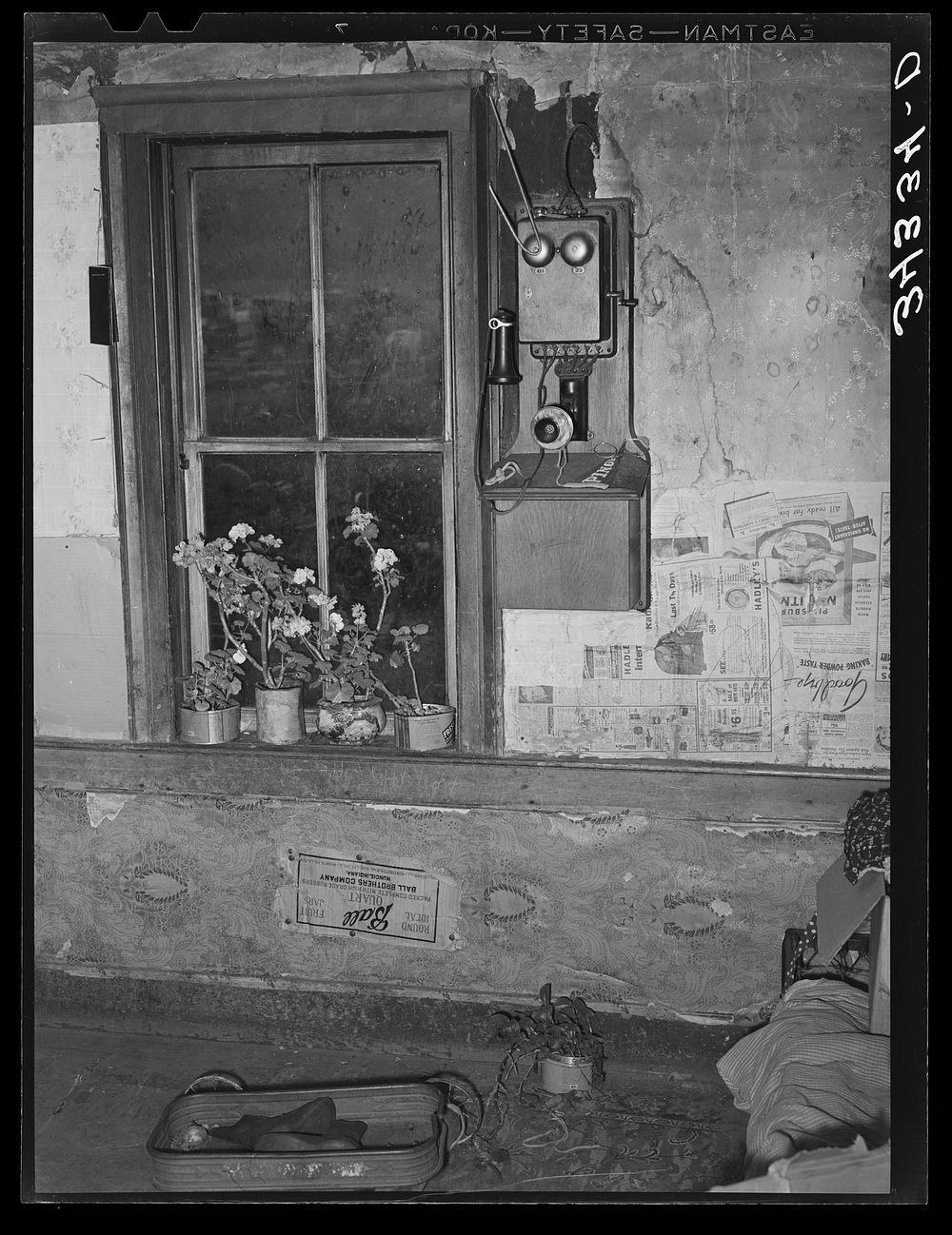 Telephone by window in farm home of FSA (Farm Security Administration) client near Bradford, Vermont. Orange County by…