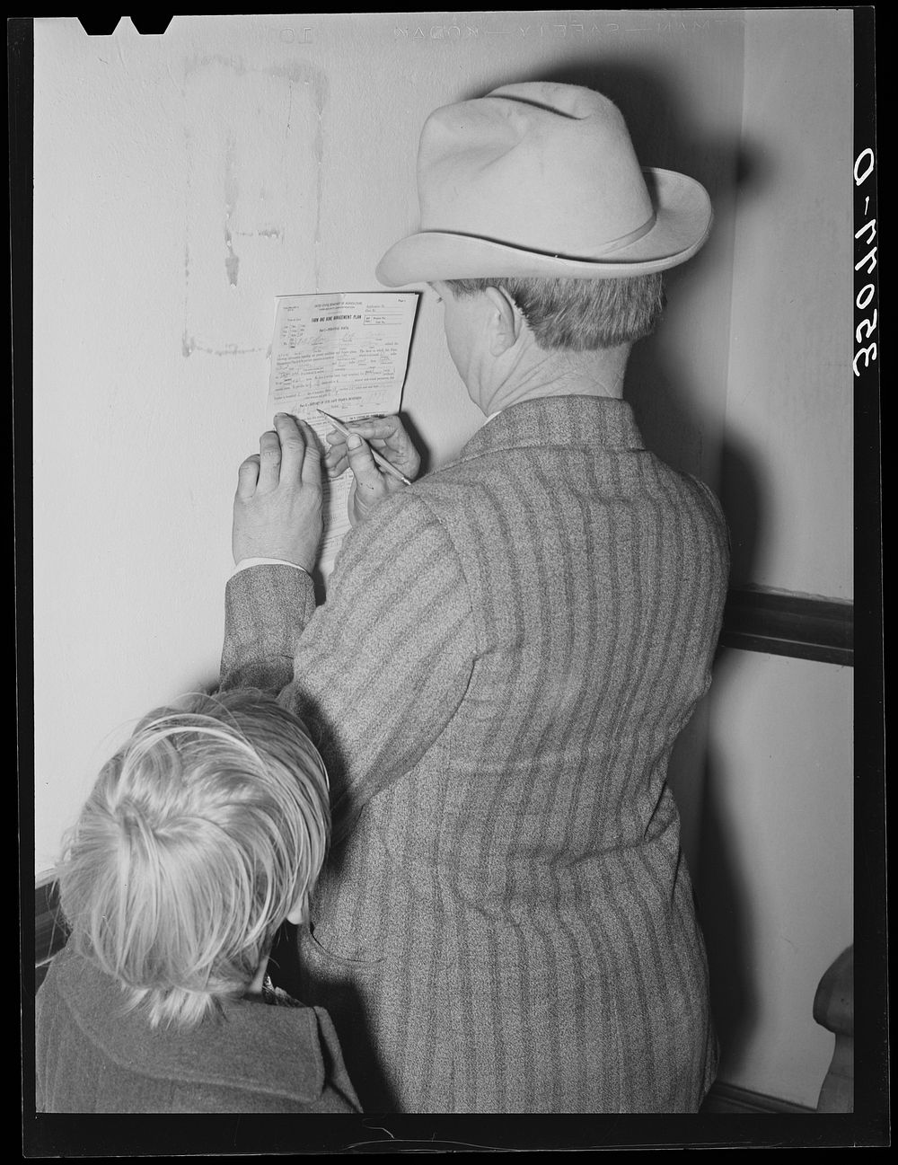 FSA (Farm Security Administration) client making out farm and home plan. Mason, Texas by Russell Lee