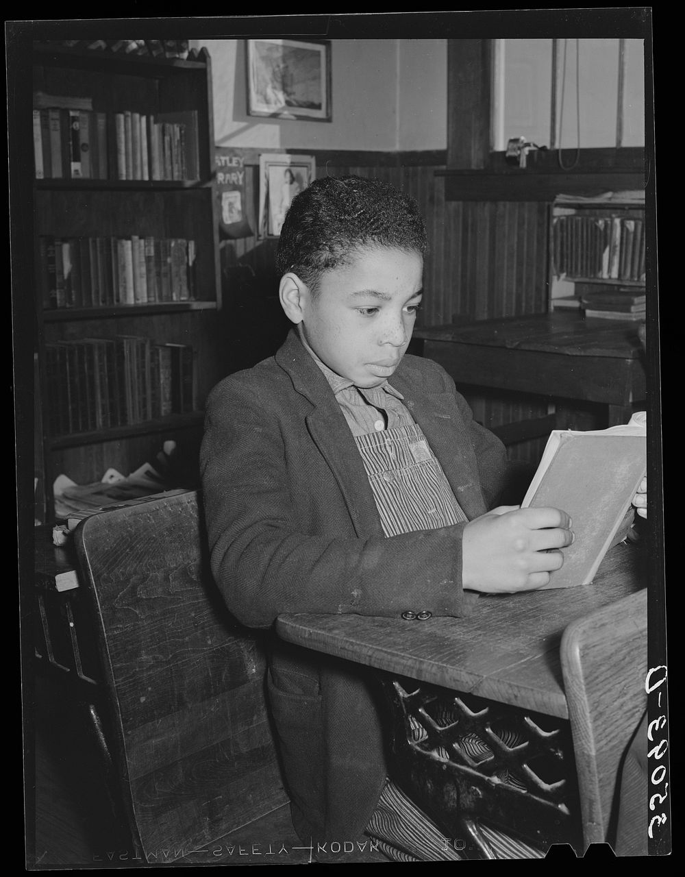 Son of Pomp Hall, tenant farmer, studying in rural school. Creek County, Oklahoma. See general caption number 23 by Russell…