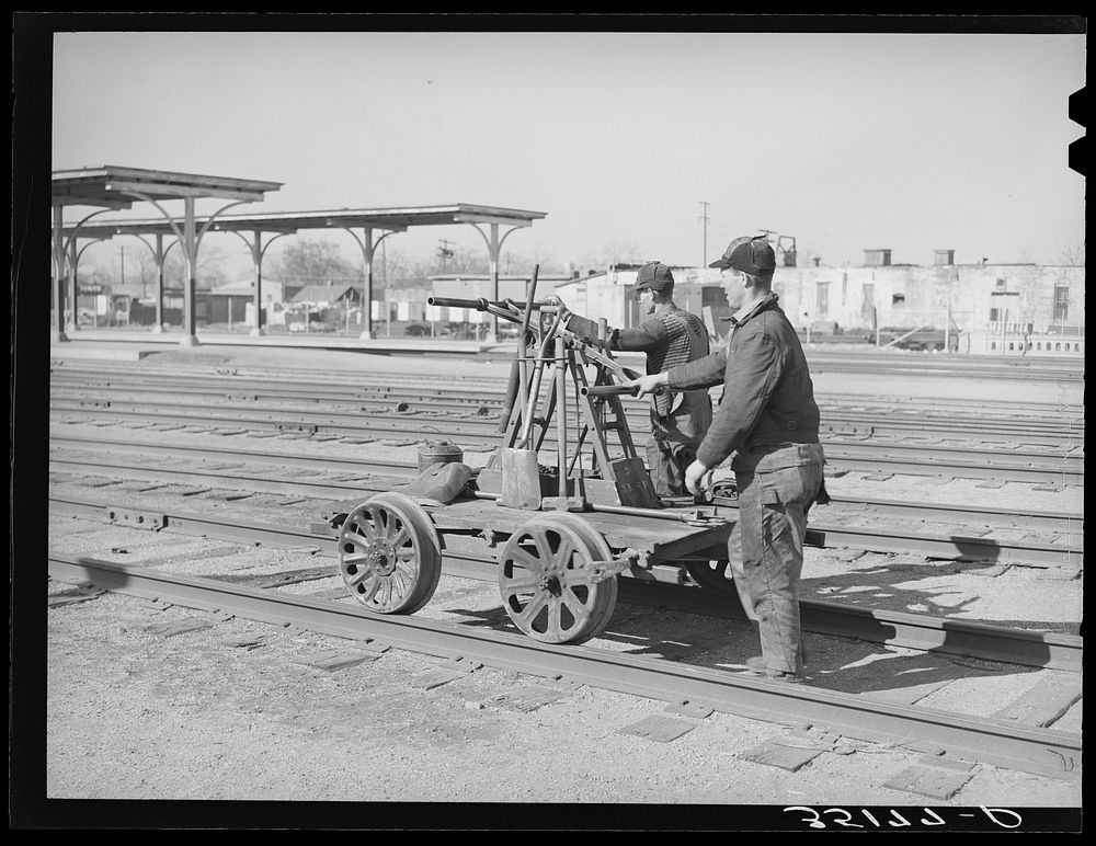 Railway workmen with hand car. Oklahoma City, Oklahoma by Russell Lee