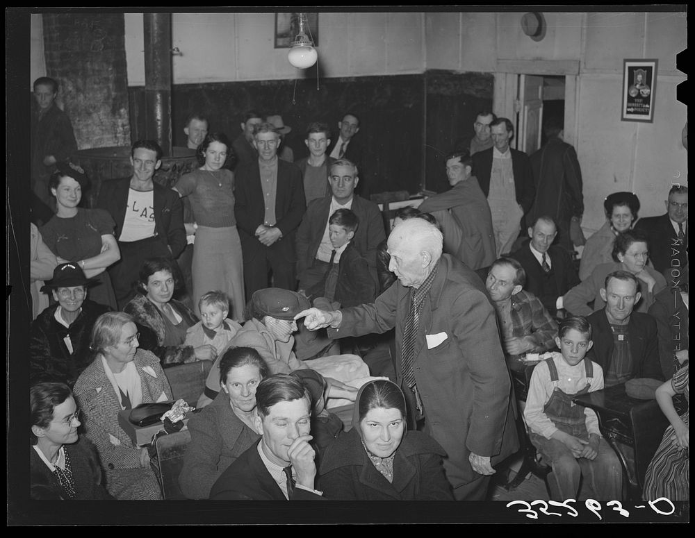 [Untitled photo, possibly related to: Auctioning off the pies at pie supper in the school house. Muskogee County, Oklahoma.…