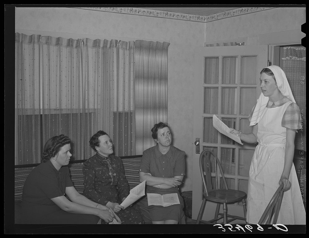 FSA (Farm Security Administration) supervisor instructing other supervisors in canning methods at a district meeting. San…