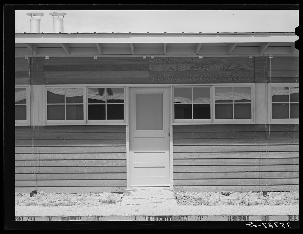 Entrance to a unit in the row shelters for migratory workers at the migratory labor camp. Sinton, Texas by Russell Lee