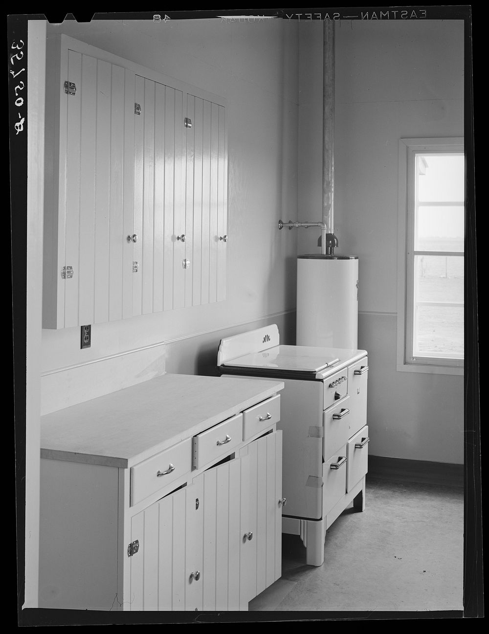 [Untitled photo, possibly related to: Kitchen in the community building at the migratory labor camp. Robstown, Texas] by…