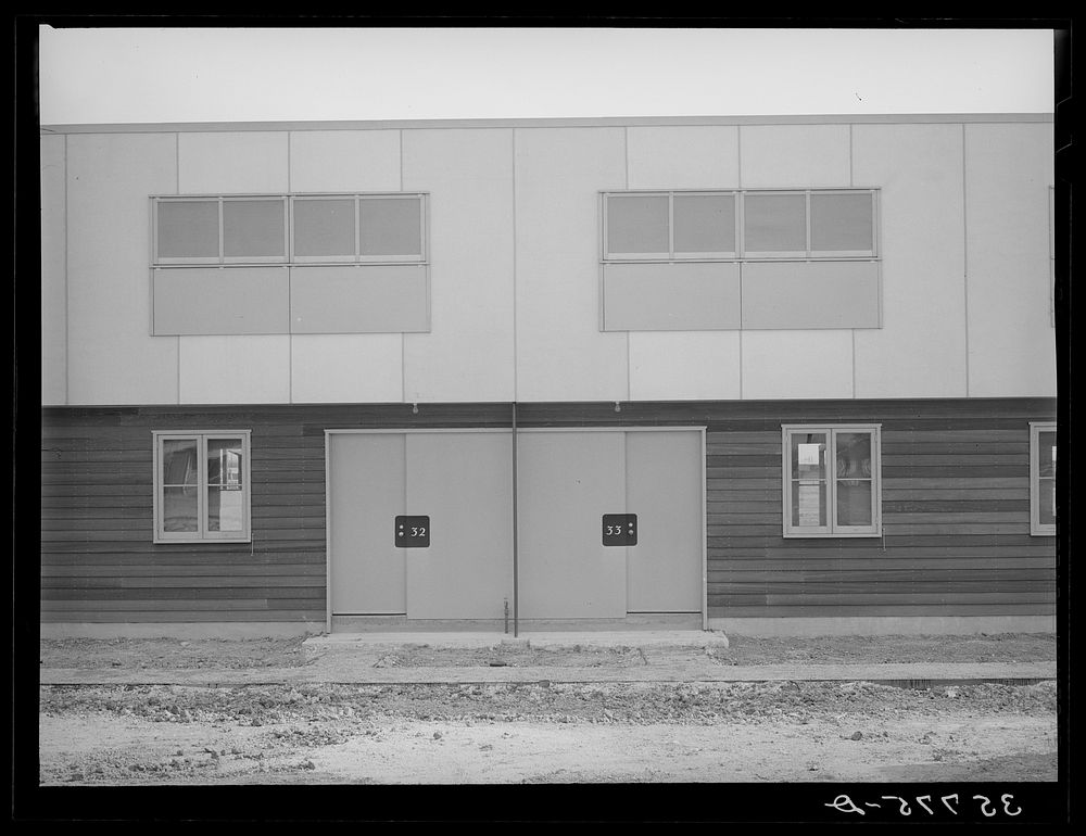 Entrances to multi-family units designed for permanent agricultural workers at the migratory labor camp. Sinton, Texas by…