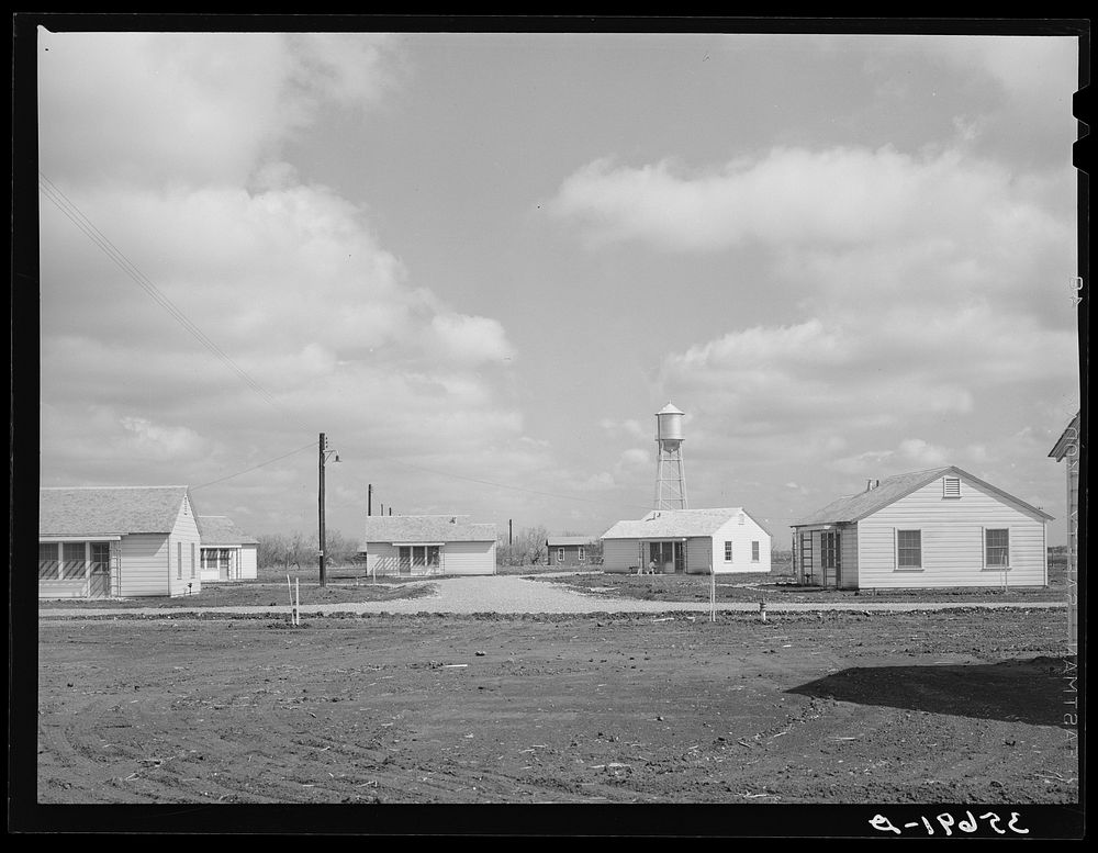 [Untitled photo, possibly related to: Group of houses for permanent agricultural workers at the migratory labor camp.…