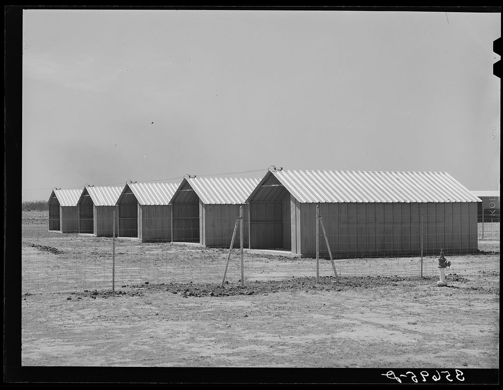Sheet metal isolation units at the migratory labor camp. Sinton, Texas. These will be used for isolation of people at the…