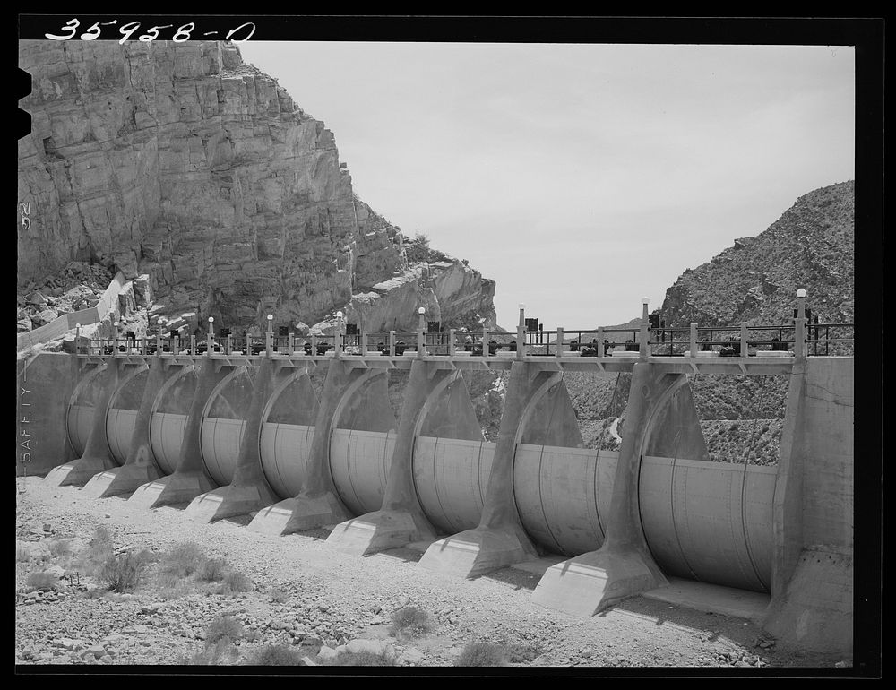 Auxiliary sluice gates which have never been used. Roosevelt Dam, Arizona by Russell Lee