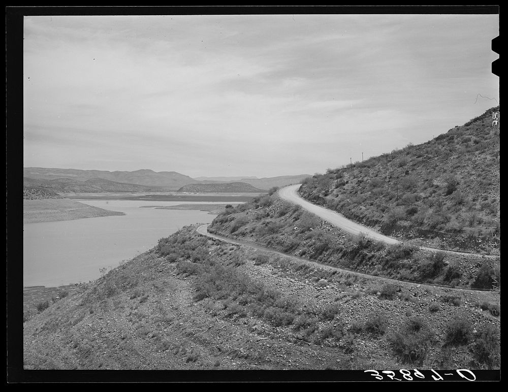 [Untitled photo, possibly related to: Reservoir of Roosevelt Dam with irrigation ditches and highway. Gila County, Arizona]…