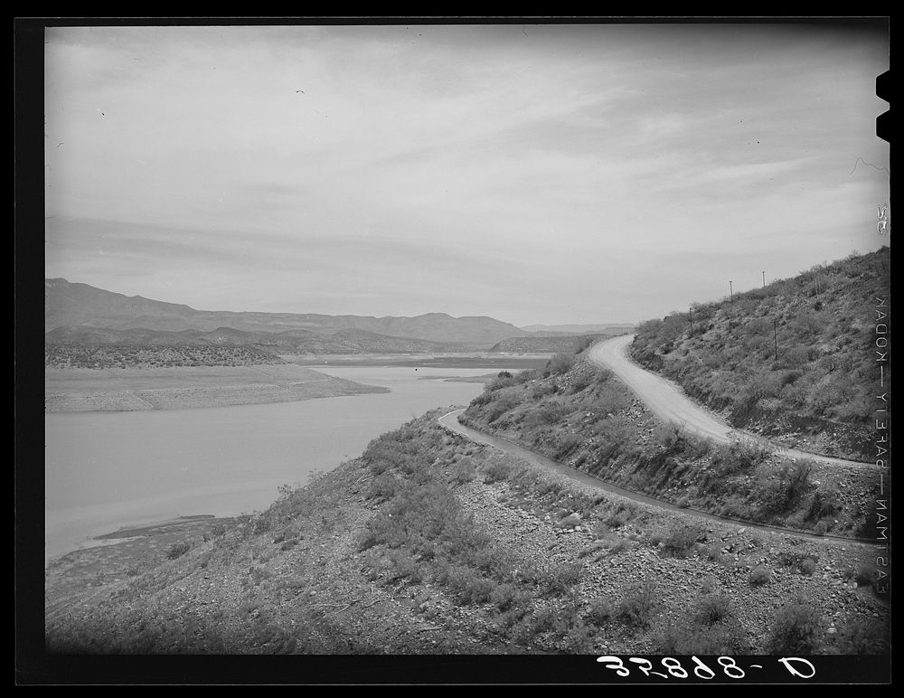 [Untitled photo, possibly related to: Reservoir of Roosevelt Dam with irrigation ditches and highway. Gila County, Arizona]…