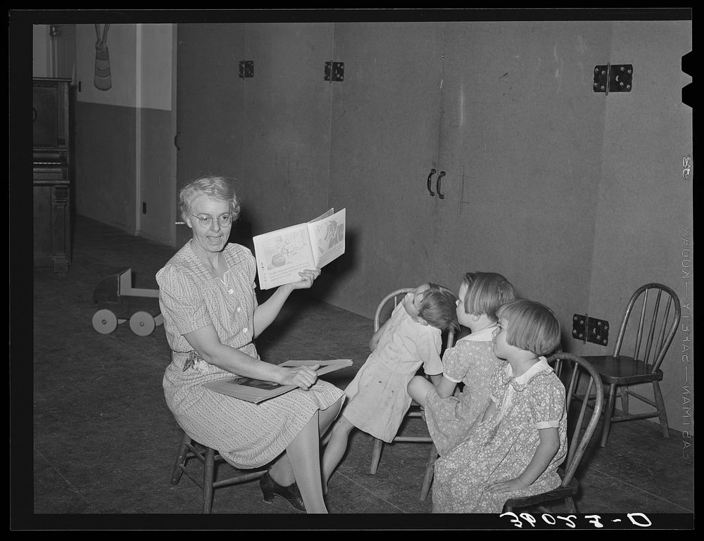 [Untitled photo, possibly related to: WPA (Work Projects Administration) nursery teacher telling story to children of…