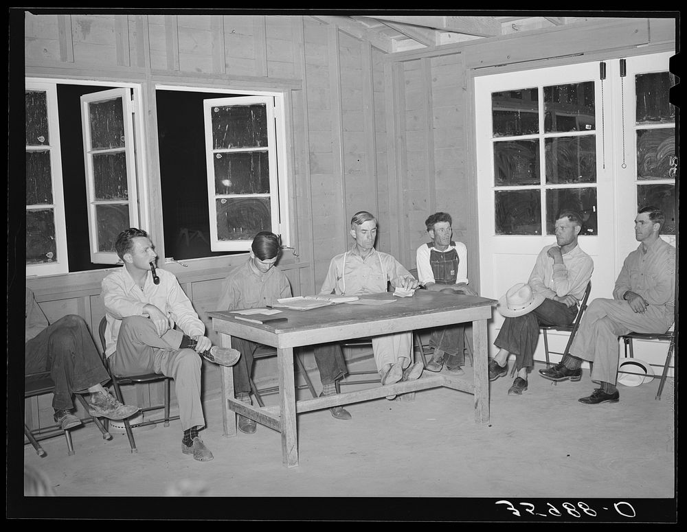 Meeting of camp committee with the camp manager at Aqua Fria migratory labor camp, Arizona. This camp committee is a…