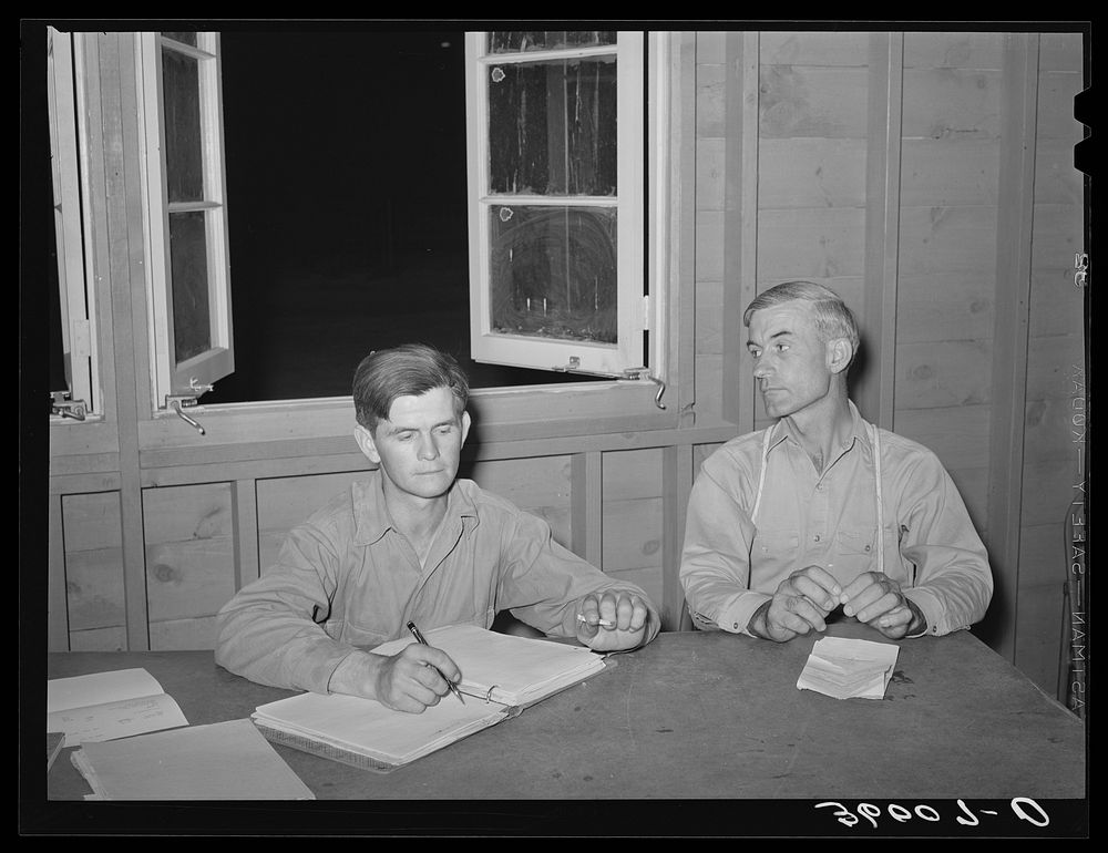 President and secretary of the camp committee at the Aqua Fria migratory labor camp, Arizona. Members of the committee are…