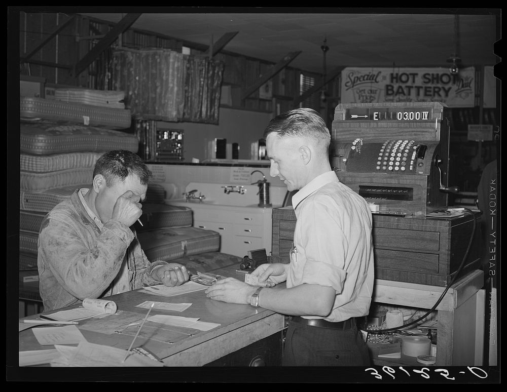 [Untitled photo, possibly related to: The cashier of the United Producers and Consumers Cooperative of Phoenix, Arizona] by…