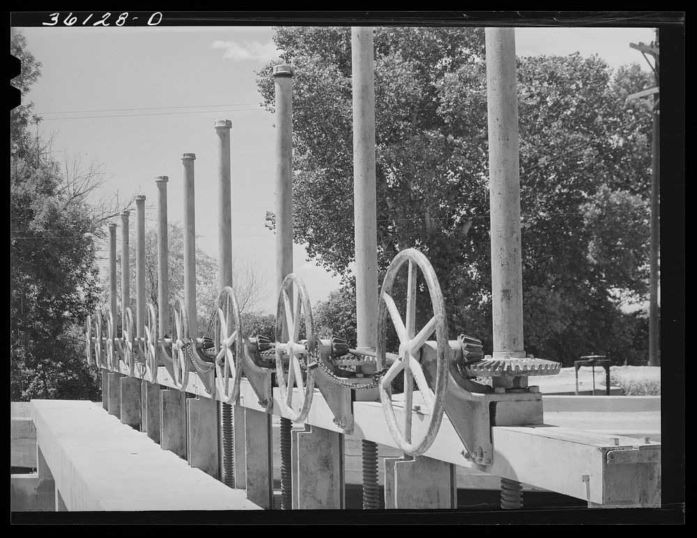 Valves to irrigation gates. Main irrigation canal in Maricopa County, Arizona by Russell Lee