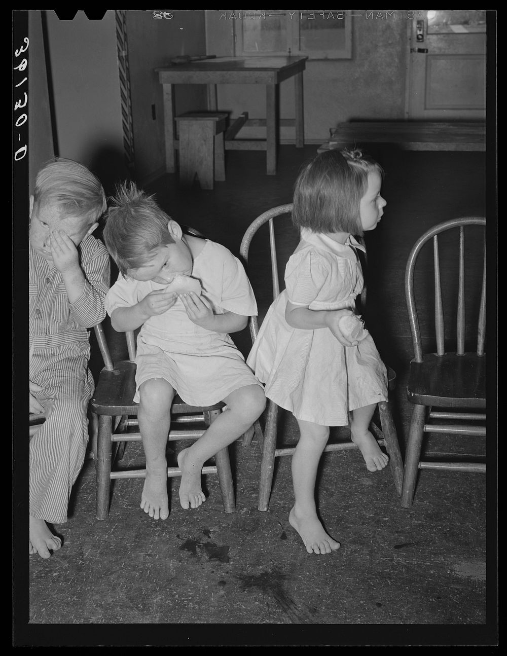 Children eating grapefruit after taking cod liver oil at the WPA (Work Projects Administration) nursery school at Agua Fria…