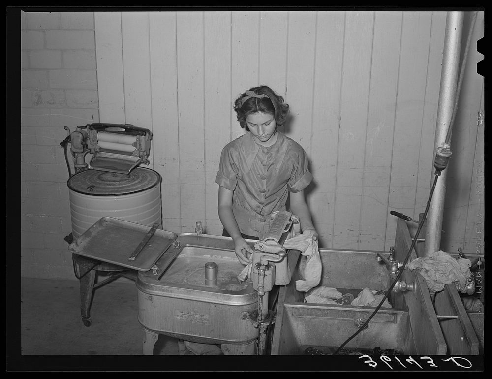 Doing the laundry at the Agua Fria migratory labor camp. Arizona by Russell Lee