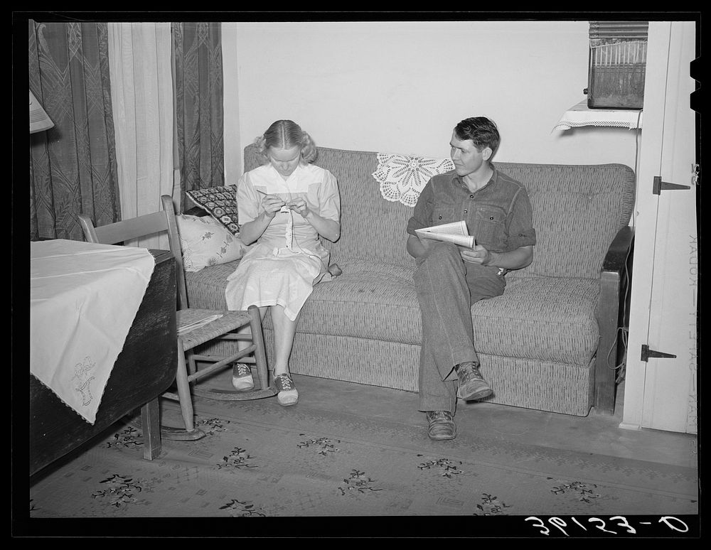 Member of the Arizona part-time farms, Chandler Unit, Maricopa County, Arizona, and his wife in their apartment by Russell…