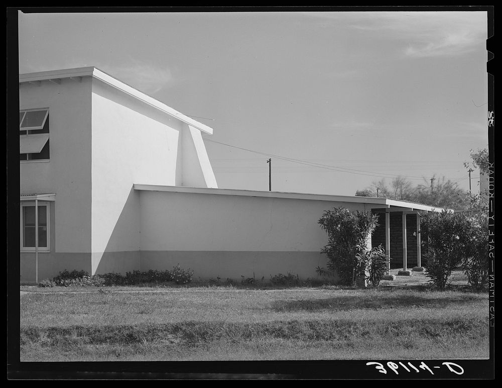 Detail of corner of apartment house and garage at Arizona part-time farms. Chandler Unit, Maricopa County, Arizona by…