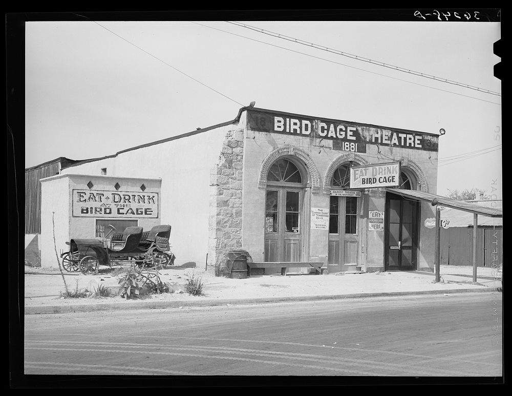 Bird Cage Theater, scene of riotous entertainment during the mining boom days. Tombstone, Arizona by Russell Lee