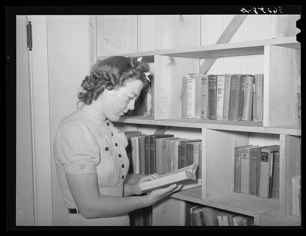 Librarian of the small lending library at the Casa Grande Valley Farms. Pinal County, Arizona by Russell Lee