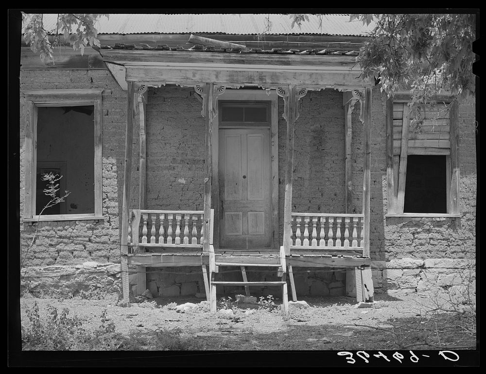 Front of abandoned residence in Georgetown, New Mexico. Ghost gold mining town by Russell Lee