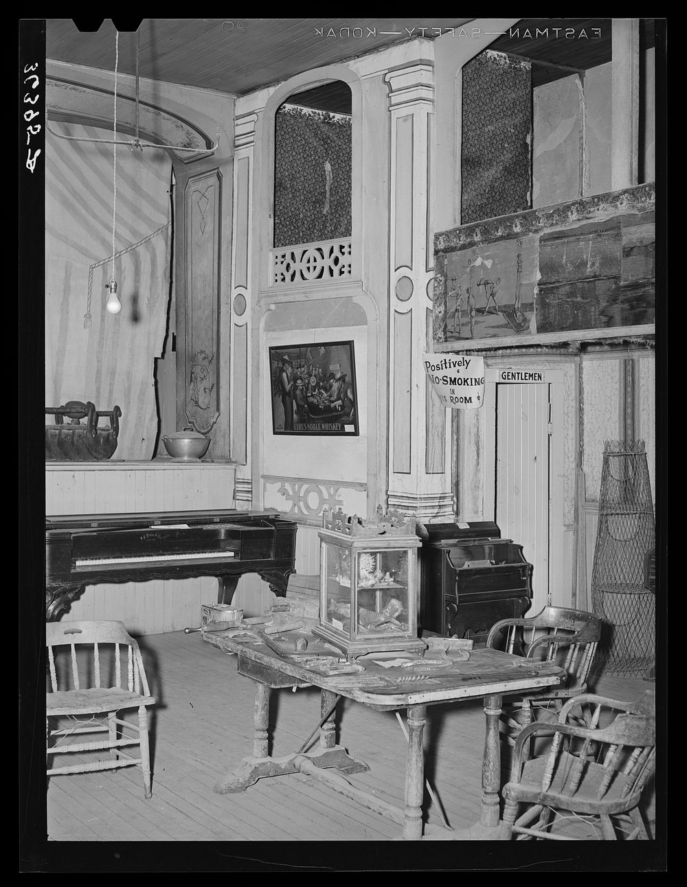 [Untitled photo, possibly related to: Corner of the Bird Cage Theater, now a museum. Notice boxes at the side. These were…