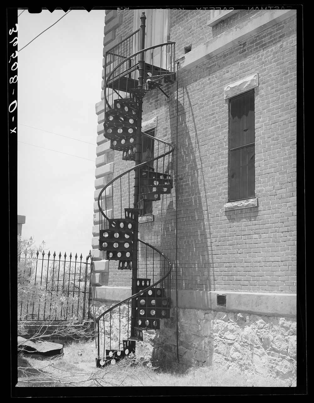 Fire escape in abandoned courthouse at Tombstone, Arizona by Russell Lee