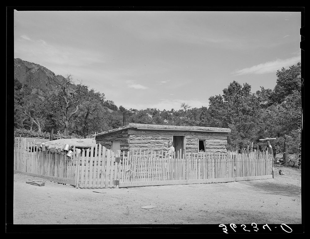Home of Jack Whinery at Pie Town, New Mexico. The original dugout house cost him thirty cents for nails, and took him ten…