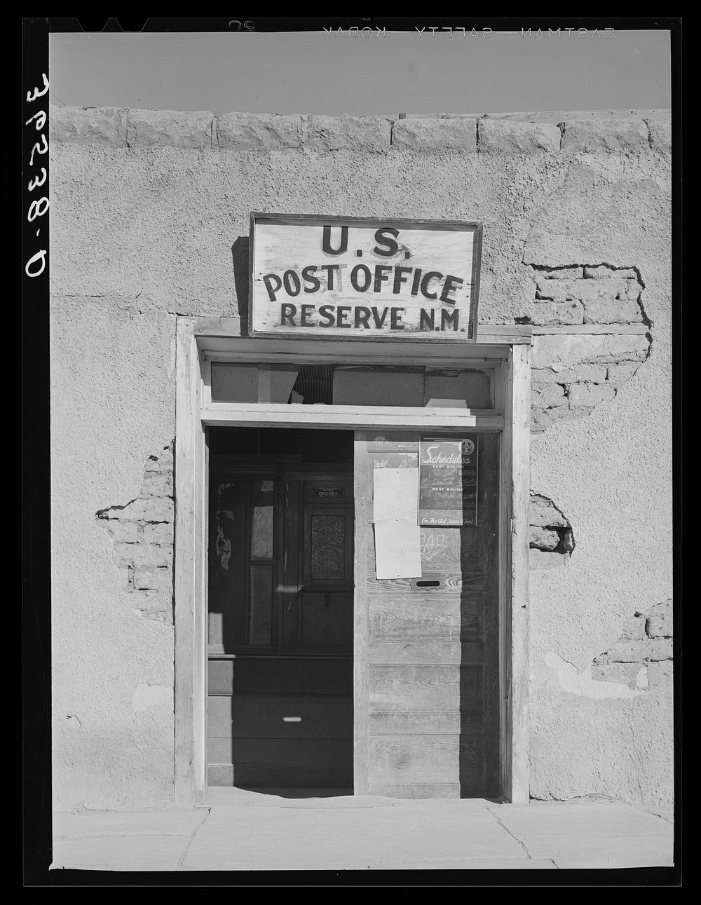 Entrance to adobe post office at Reserve, New Mexico. Reserve is the county seat of Catron County, a county in which no…