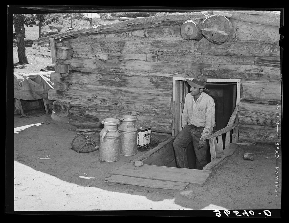 [Untitled photo, possibly related to: Faro Caudill, homesteader, coming up out of his dugout. Pie Town, New Mexico] by…