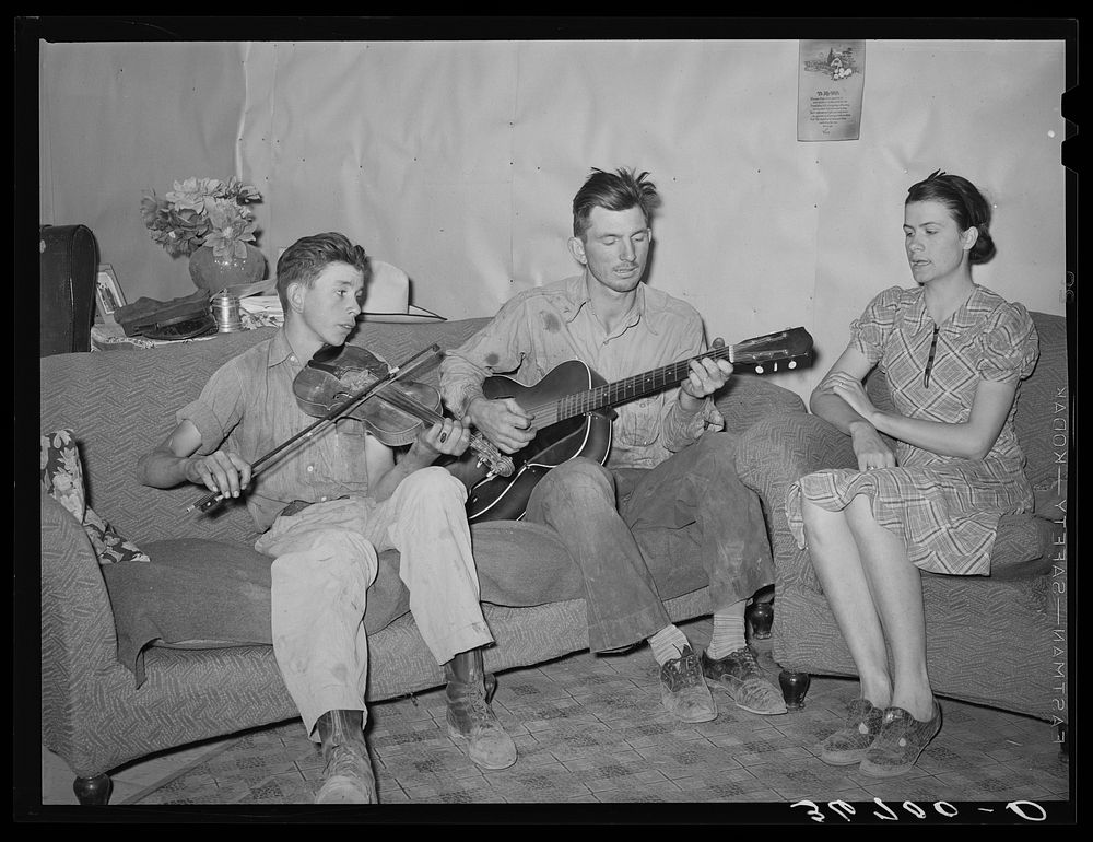 Farmer, his wife, and brother in close harmony. Pie Town, New Mexico by Russell Lee